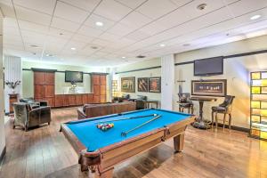 a billiard room with a pool table and a bar at Historical Apt in Dtwn Omaha - Pets Welcome! in Omaha