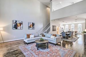 a living room with a couch and a table at Modern Houston Gem about Walk to Minute Maid Park in Houston