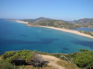 a view of a beach and the ocean at Hotel Su Giudeu in Chia