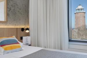Posteľ alebo postele v izbe v ubytovaní Apartamenty z widokiem na morze i dziedziniec BalticON Morska 6