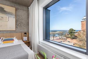 Posteľ alebo postele v izbe v ubytovaní Apartamenty z widokiem na morze i dziedziniec BalticON Morska 6