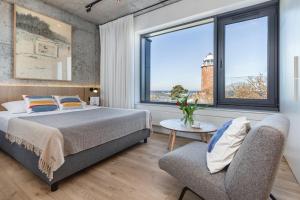 Posteľ alebo postele v izbe v ubytovaní Apartamenty z widokiem na morze i dziedziniec BalticON Morska 6