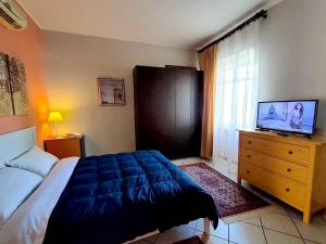 En eller flere senge i et værelse på Alba la capitale delle Langhe