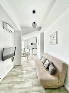 Televízia a/alebo spoločenská miestnosť v ubytovaní Sol Apartamentos Centro Histórico