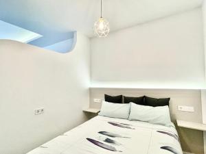 Posteľ alebo postele v izbe v ubytovaní Sol Apartamentos Centro Histórico