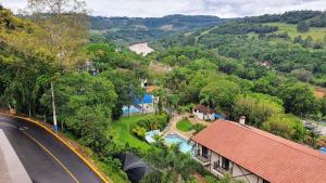 an aerial view of a village with a road and trees at Mirante das Aguas de Piratuba in Piratuba
