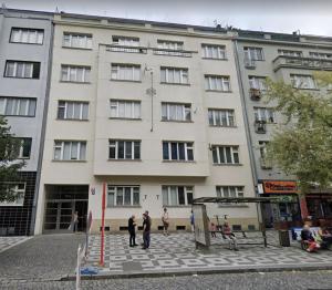 a large building with people standing in front of it at TurnKey I Studio by City Mall in Prague