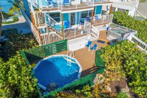 an aerial view of a house with a swimming pool at Heaven Can't Wait in Stuart