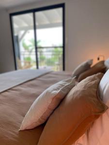 Letto o letti in una camera di Appartement duplex Kakoon Saint Martin Anse Marcel