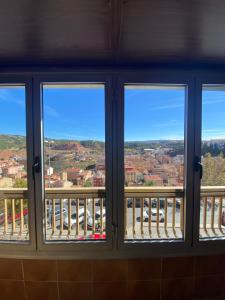 a window with views of a city seen through it at 380 Delicia de Teruel in Teruel