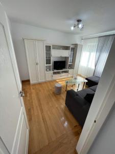 a living room with a couch and a table at Apartament Anca in Gura Humorului