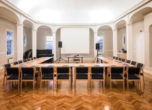 a large conference room with a large table and chairs at Langesund Bad in Langesund