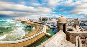 a view of a town with the ocean and buildings at StayHere, Nice Apartment with Garden and sea view, 1 min walk From Beach, High-Speed WI-FI in El Jadida