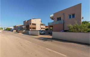 an empty street with buildings on the side of a road at 1 Bedroom Nice Apartment In Vir in Vir