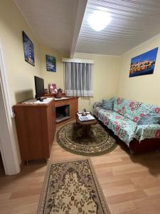 a living room with a couch and a table at Casa Violeta in Águeda