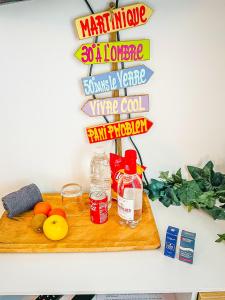 a wooden cutting board with some food on a table at Caribbean Spirit in Périgueux