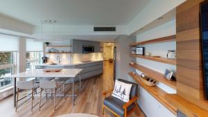 a kitchen with a table and chairs in a room at Le Chamois by Whistler Premier in Whistler