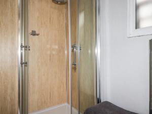a shower with a glass door in a bathroom at The View in Callington