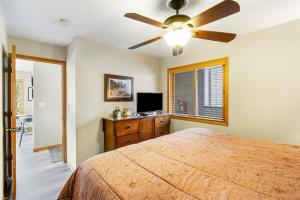 a bedroom with a bed and a ceiling fan at Watch Hill 216 in Silverthorne