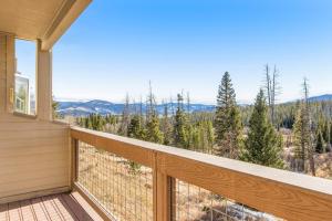 a balcony with a view of the mountains at Watch Hill 216 in Silverthorne
