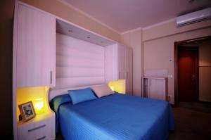 Postel nebo postele na pokoji v ubytování Hotel Olympic