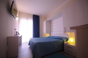 Postel nebo postele na pokoji v ubytování Hotel Olympic