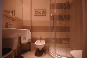 Koupelna v ubytování Hotel Olympic