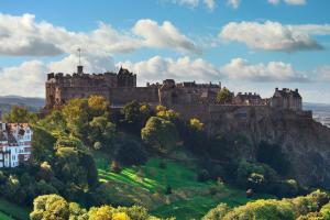 a castle on top of a hill with trees at Hotel Indigo Edinburgh by IHG in Edinburgh