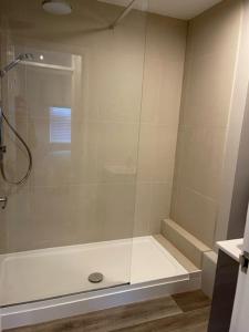 a shower with a glass door in a bathroom at Pedlars Rest in Swaffham