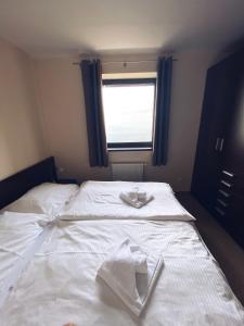 Säng eller sängar i ett rum på Apartman Deluxe Štrbské Pleso