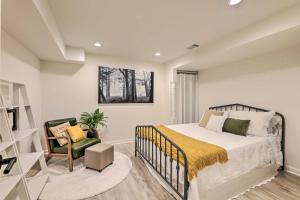 a bedroom with a bed and a chair at Luxury Maineville Villa with Private Pool and Deck in Maineville +33 photos