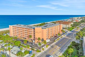 an aerial view of a hotel and the ocean at Reef Club 307 in Clearwater Beach