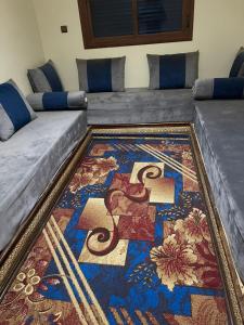 En eller flere senge i et værelse på Appartements Rihanna Merzouga