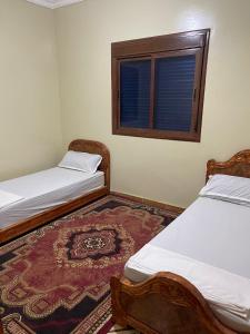 En eller flere senge i et værelse på Appartements Rihanna Merzouga