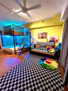 a room with two bunk beds and a play room with a bed at Kaw Supreme Theme WIFI Luxury 7 PAX Genting Pool & Mountain View Cuti Genting Homestay Midhills in Genting Highlands