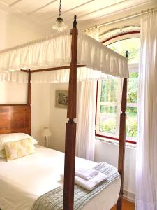 Cama ou camas em um quarto em Villa Margaridi