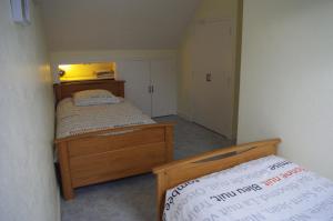 Postel nebo postele na pokoji v ubytování Gîtes du Clos du Ratz