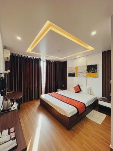 Tempat tidur dalam kamar di DT Hotel Hai Phong