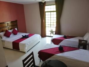 Postel nebo postele na pokoji v ubytování Answer hotel