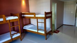 a group of bunk beds in a room at Answer hotel in Puerto Galera