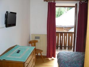 TV a/nebo společenská místnost v ubytování Albergo Valgranda