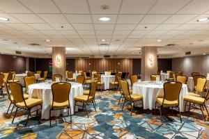 a conference room with tables and chairs in a room at Holiday Inn Toronto Downtown Centre by IHG in Toronto +174 photos