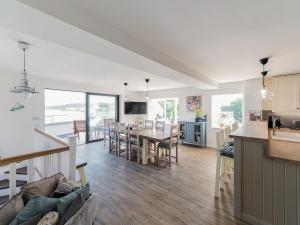 a kitchen and living room with a table and chairs at Stanton in Bangor