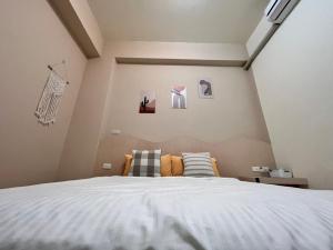 Uma cama ou camas num quarto em 澎湖樂在綺中民宿 第580號