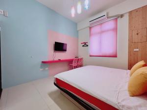 Uma cama ou camas num quarto em 澎湖樂在綺中民宿 第580號