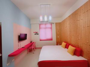 Uma cama ou camas num quarto em 澎湖樂在綺中民宿 第580號