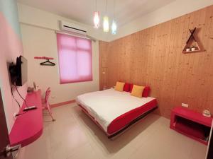 Uma cama ou camas num quarto em 澎湖樂在綺中民宿 第580號