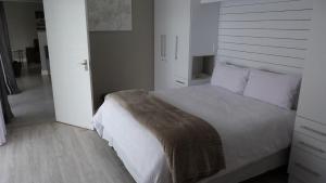 Postel nebo postele na pokoji v ubytování Settle inn Self Catering Units