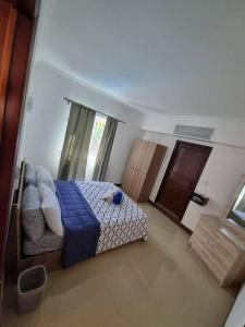 Postel nebo postele na pokoji v ubytování Villa Palmira 6 suites avec piscine 5 min à pied de la plage Pereybere