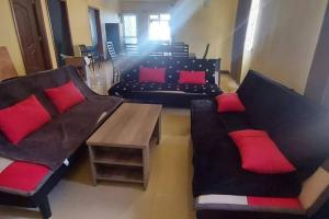 Posezení v ubytování Villa Palmira 6 suites avec piscine 5 min à pied de la plage Pereybere